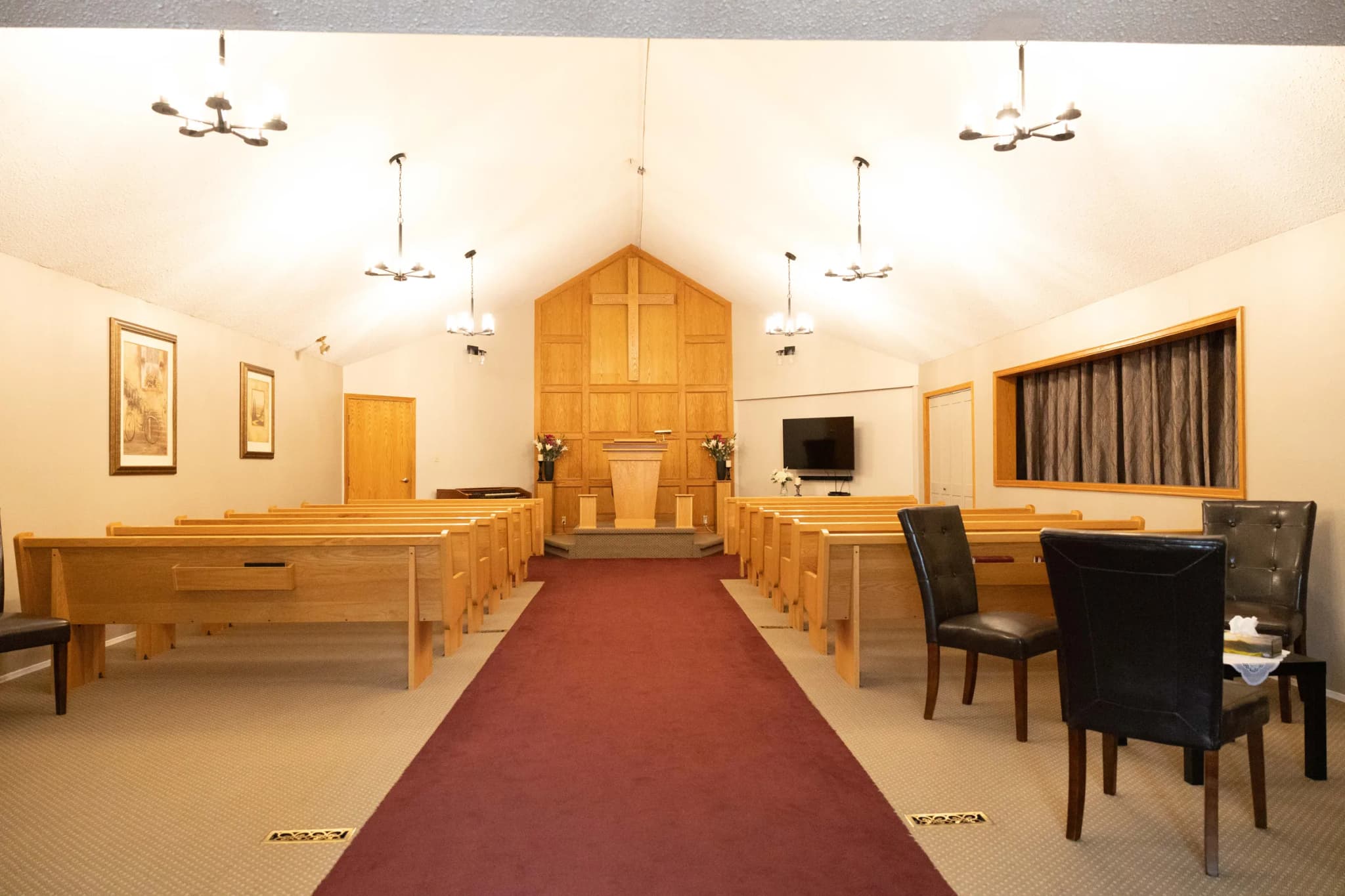 The centre aisle of the chapel at Edson Funeral Home
